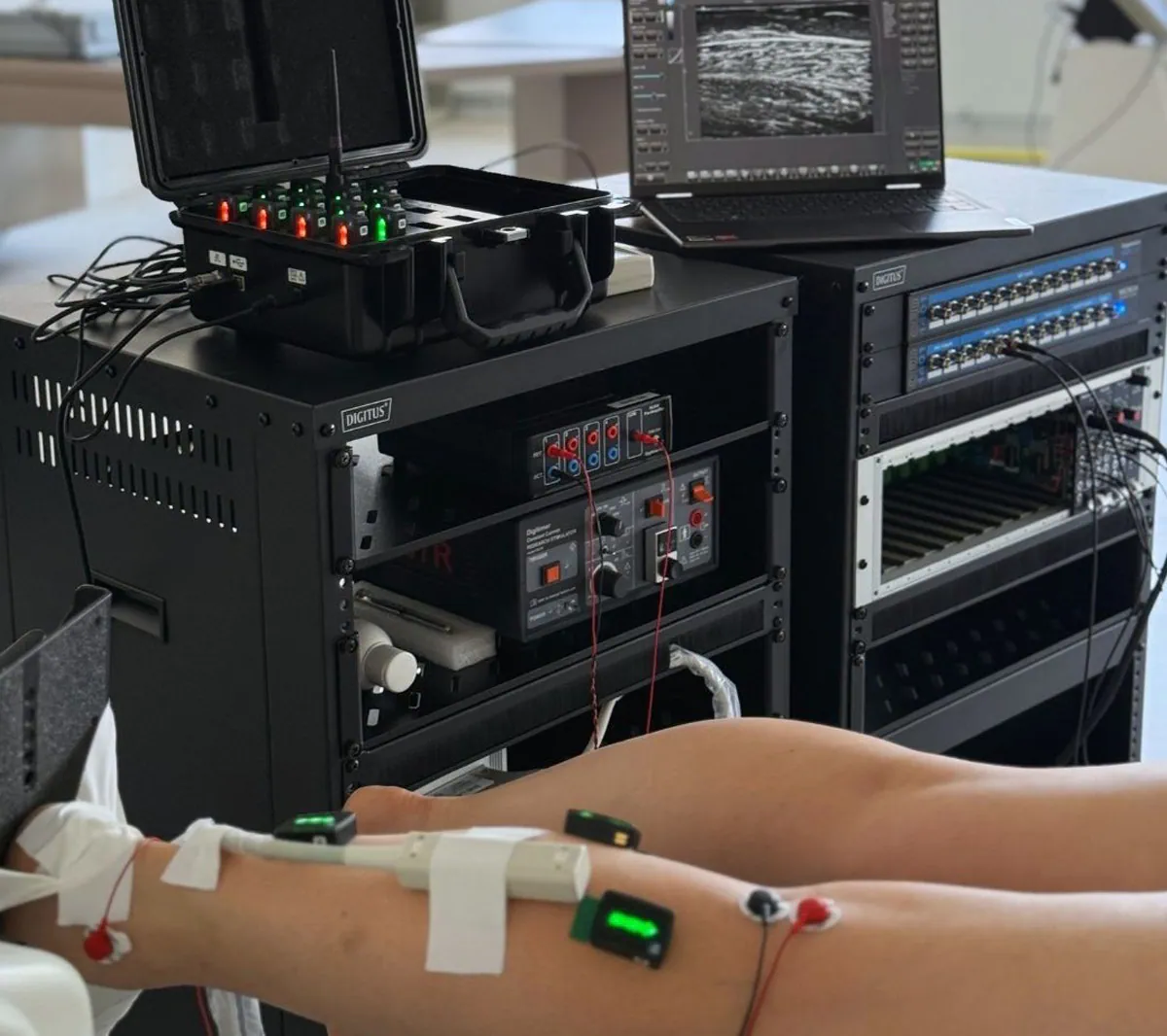 An experimental setup highlighting the hardware configuration and spatial constraints when using EMG and ultrasound together.